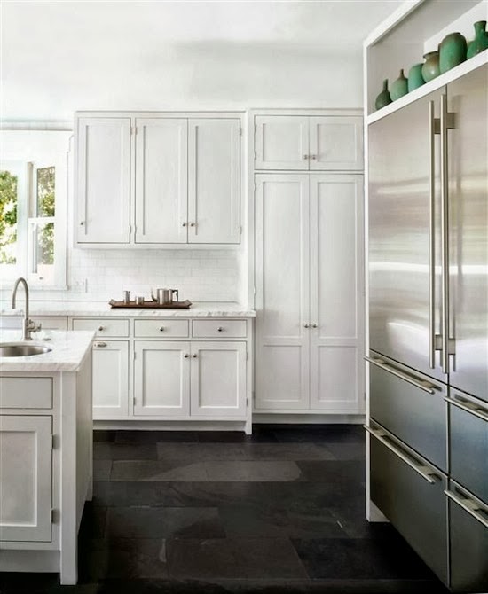 white kitchen with slate black floor