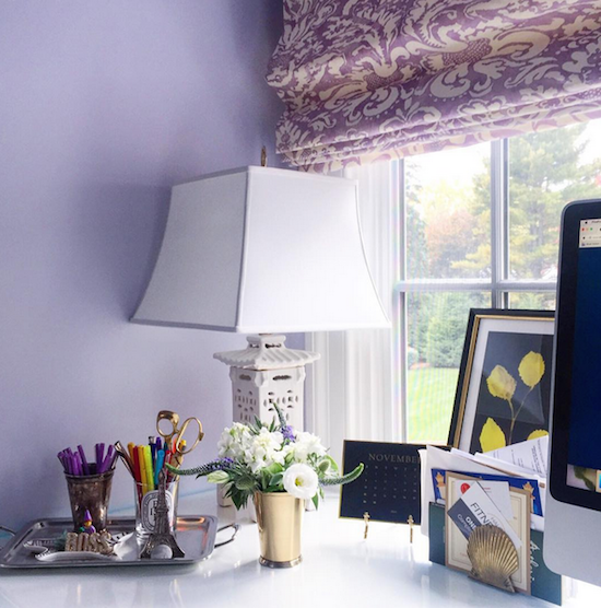 desk with lamp and flowers