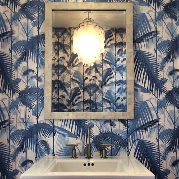 blue palm wallpaper in bathroom