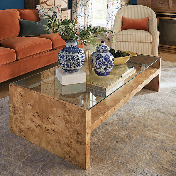 burl wood coffee table in a living room.
