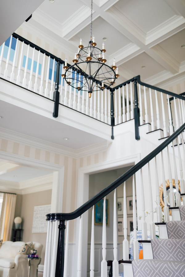 A foyer staircase which illustrates different options on How to Select the right paint finish.