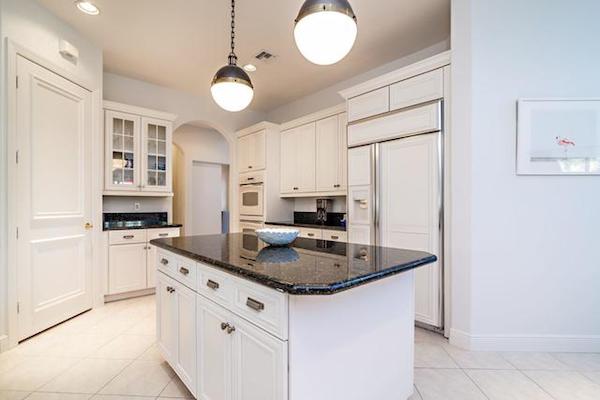 white cabinets and walls and trim all painted one color in kitchen