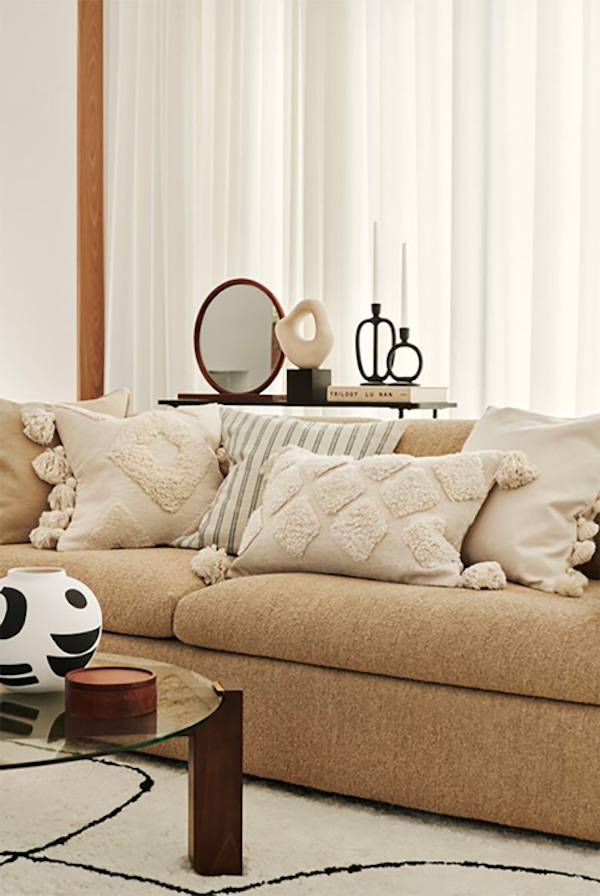 neutral throw pillows on a couch