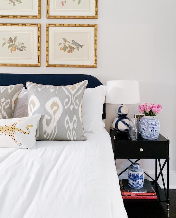 guest bedroom night stand with blue and white lamp