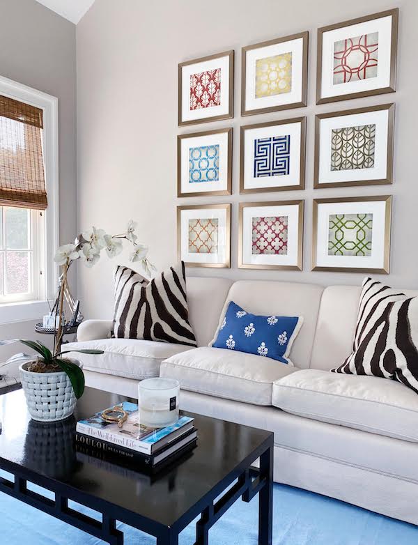 how to perfectly style the blank wall behind your sofa example with grid art hung above sofa