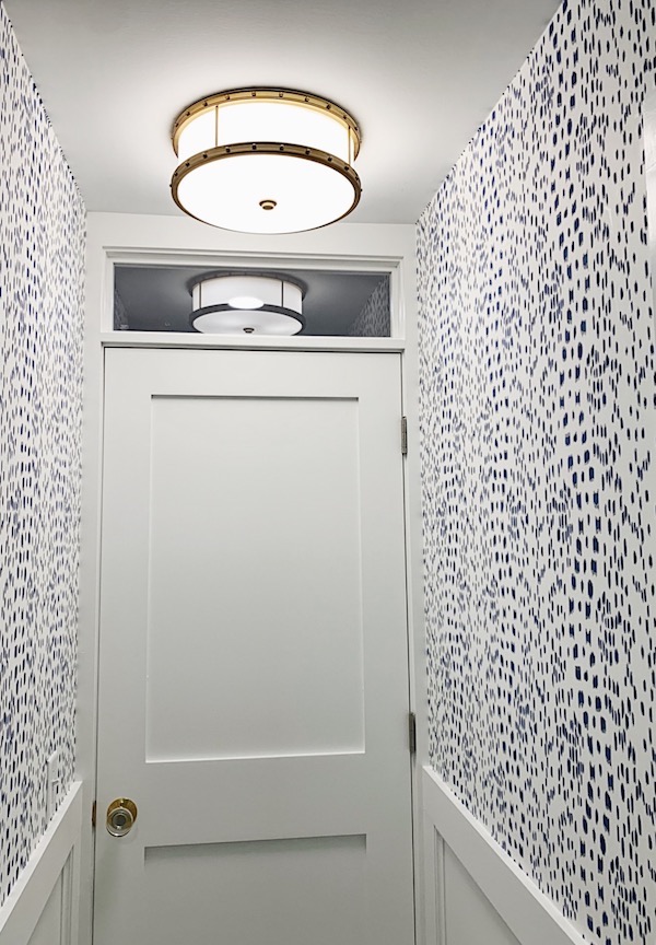 flush mount light in small bathroom with blue and white wallpaper les touche