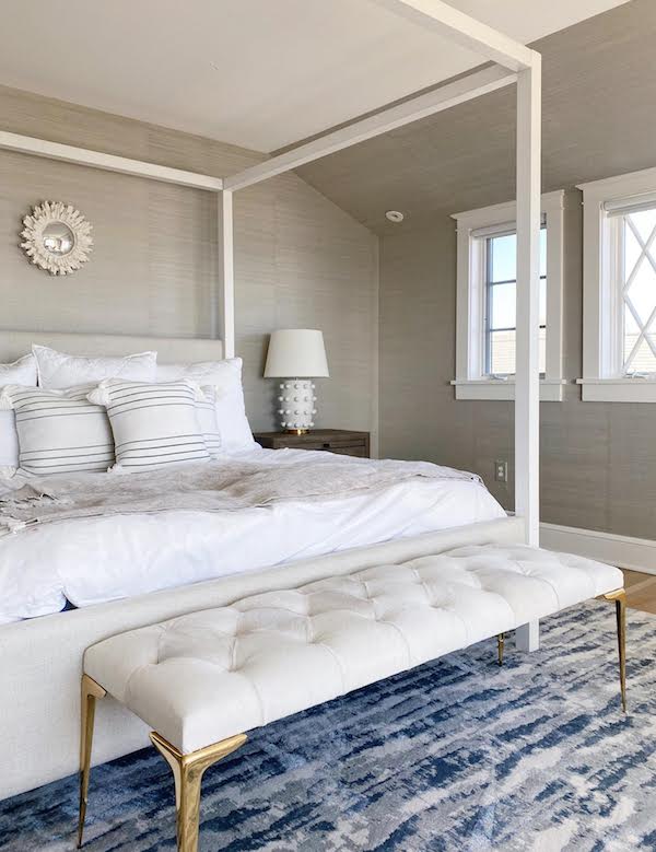 canopy bed in gray and blue bedroom