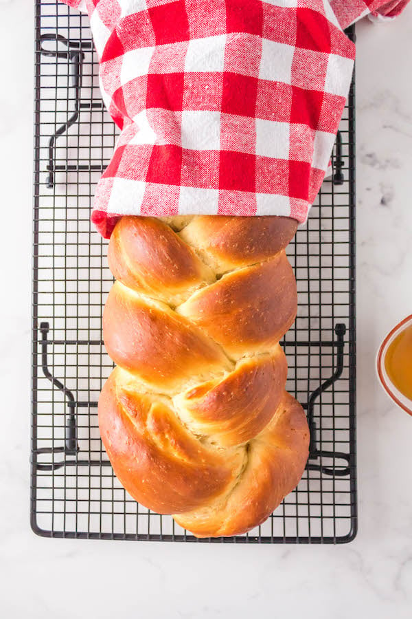 braided Challah bread on cooling rack