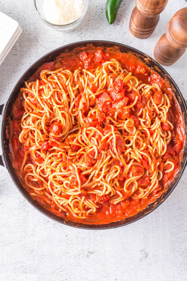 pasta in red sauce in pan