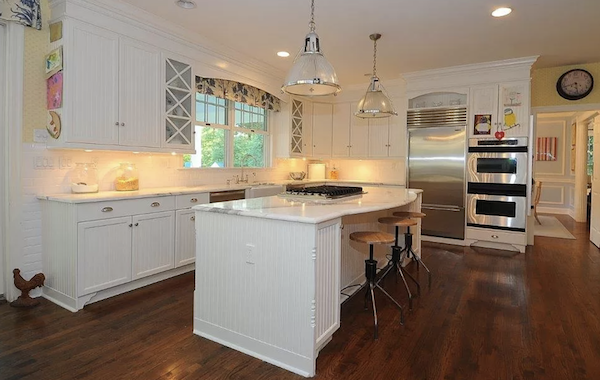 white kitchen with white subway tile backsplash.