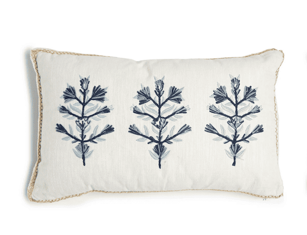 blue and white embroidered pillow.
