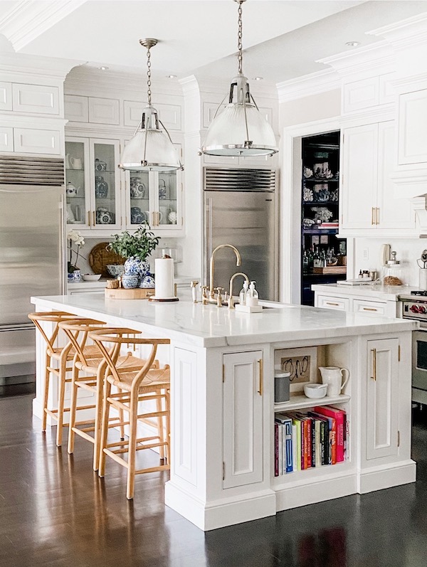 kitchen pendants over island in white kitchen.