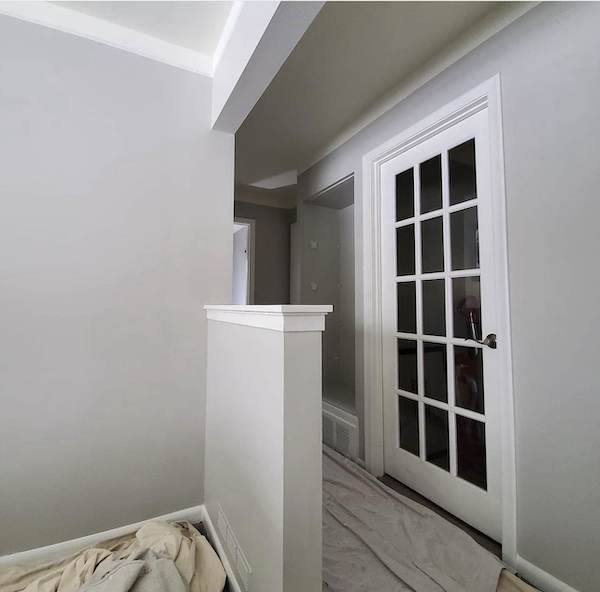 Walls painted Repose Gray by Sherwin Willaims with French door in background.