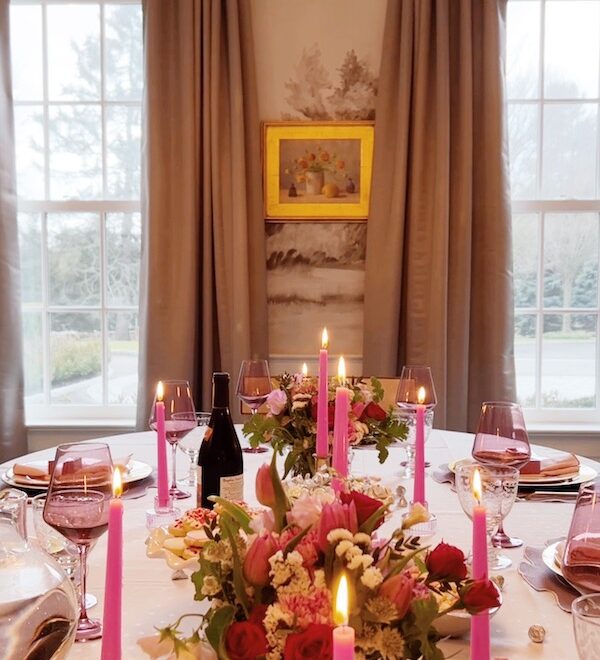 tablescape of valentines day themed setting in dining room.
