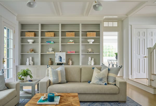 modern family room with built in bookcases.