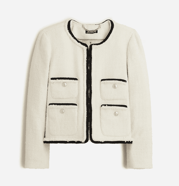 white boucle jacket with black trim.