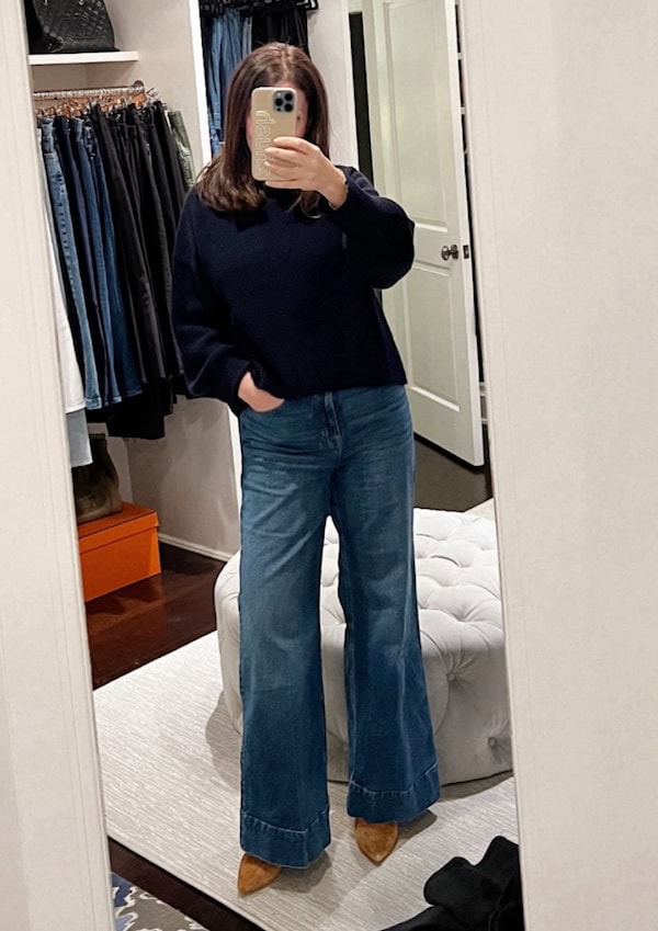 woman over 50 wide leg jeans outfit.