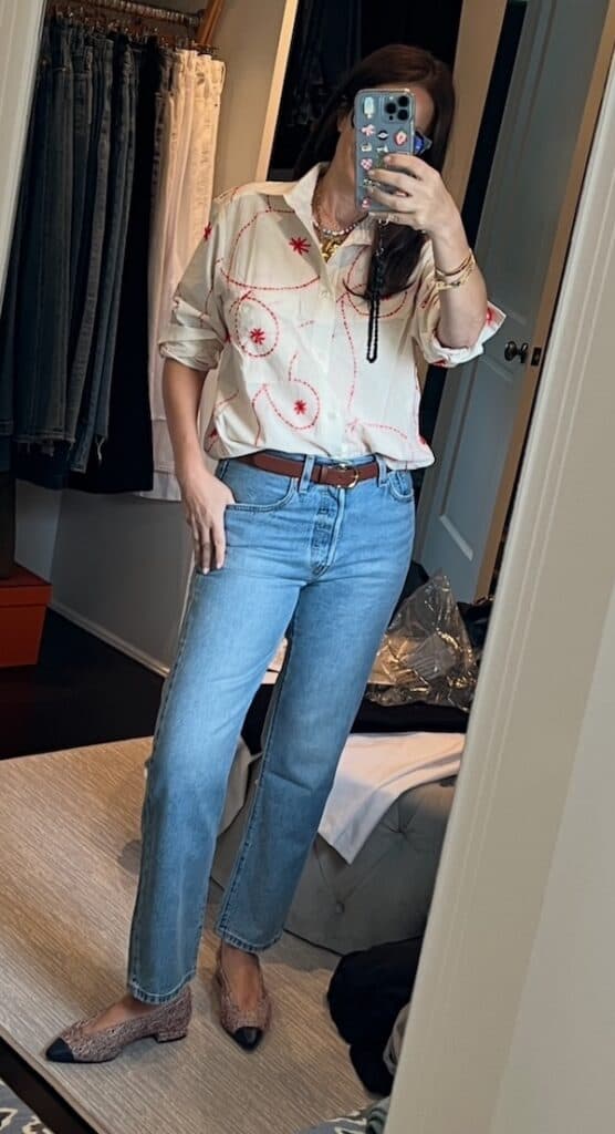 woman over 50 wearing flattering straight leg jeans.