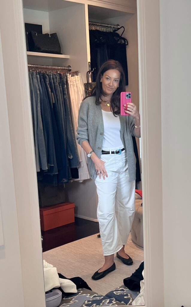 woman wearing transitional summer to fall outfit.