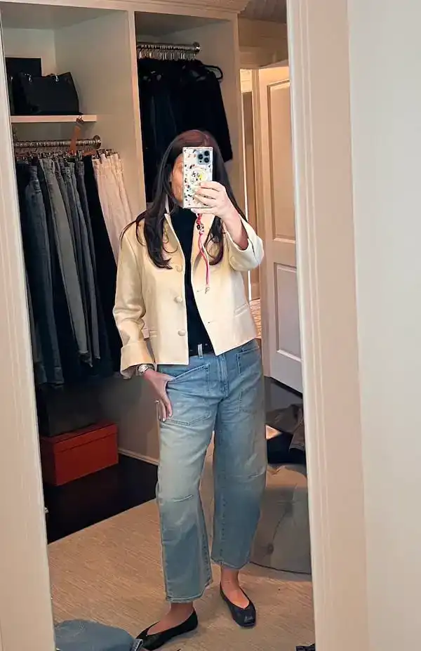 woman in fifties in casual transitional weather outfit.
