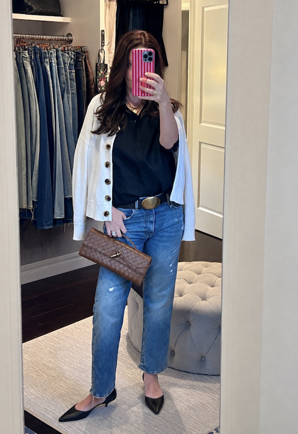 Cream cardigan over black button down shirt with jeans and black kitten heel slingbacks.