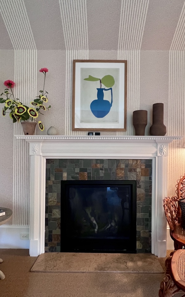 paper flowers on mantel as decor.